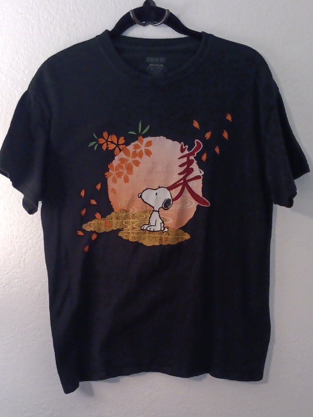 Peanuts Black Short Sleeve Tee with Orange Graphic and White Snoopy